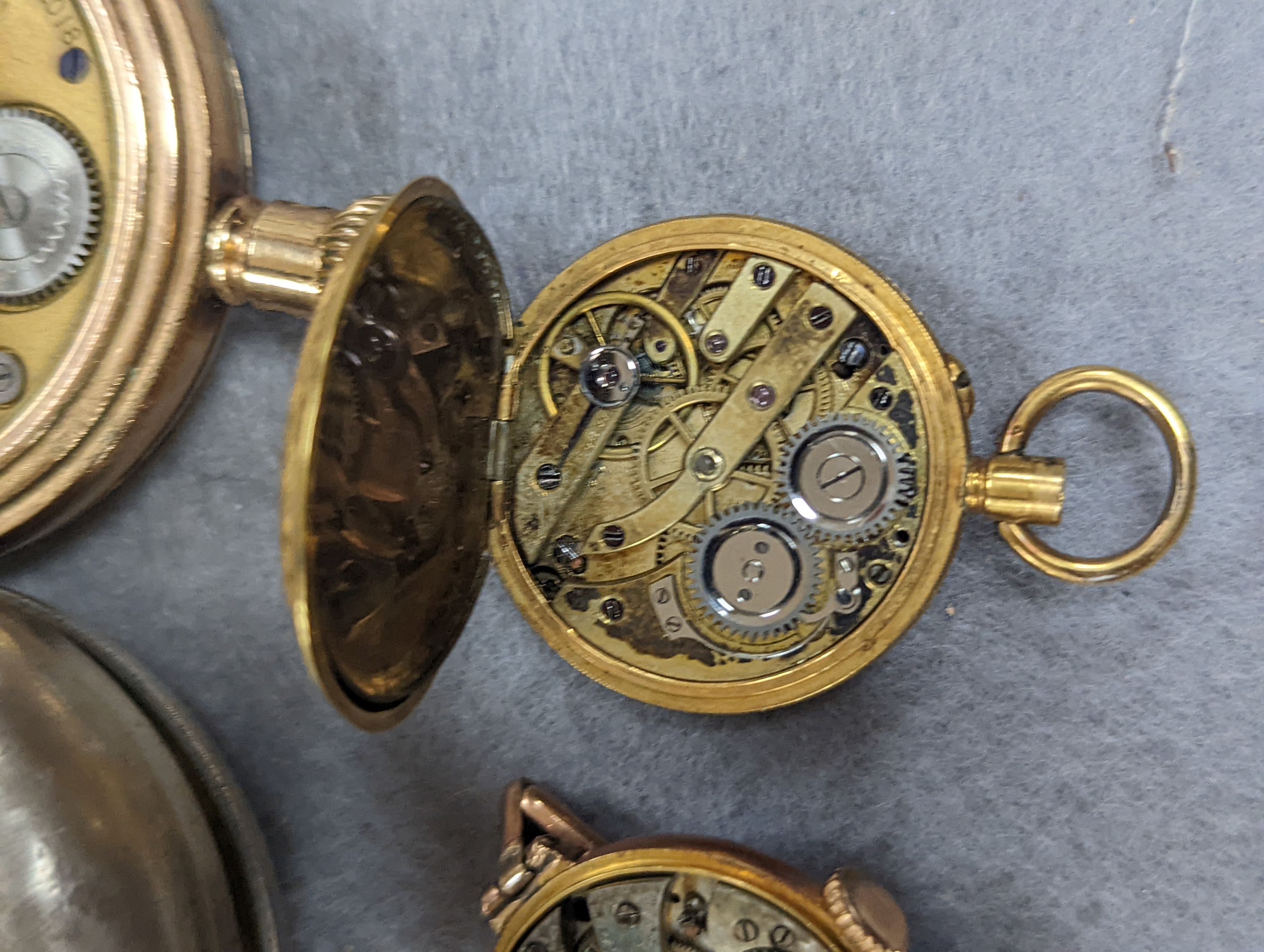 An 18k fob watch(a.f.) gross 20.4 grams, a 9ct wrist watch on a 9ct expanding bracelet, gross 20.7 grams, a gold plated pocket watch, an 800 fob watch and a 19th century silver pair cased verge keywind pocket watch, by J